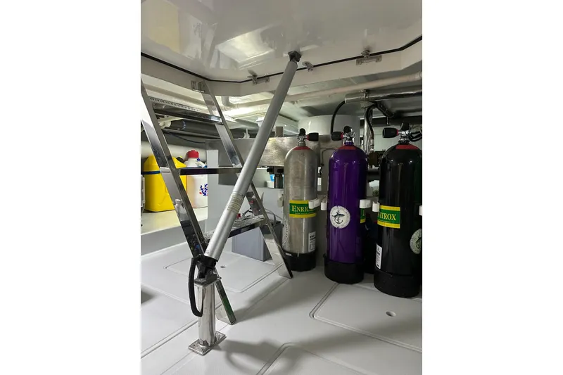 Slide: The Image of Engine room of 2016 Nordhavn 60 yacht with scuba tanks and equipment. - 38