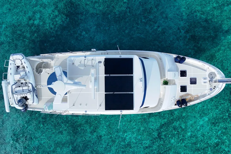 Slide: The Image of Aerial view of 2016 Nordhavn 60 yacht on clear turquoise water. - 4