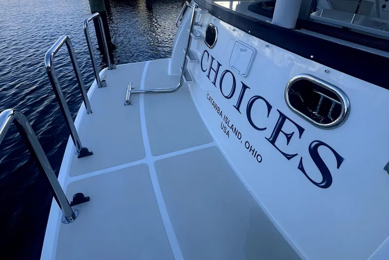 Slide: The Image of 2016 Nordhavn 60 yacht stern with "Choices" name, docked at Catawba Island, Ohio. - 5