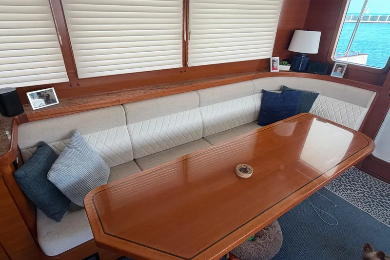 Slide: The Image of Luxurious interior of 2016 Nordhavn 60 yacht with elegant seating and wooden table. - 8