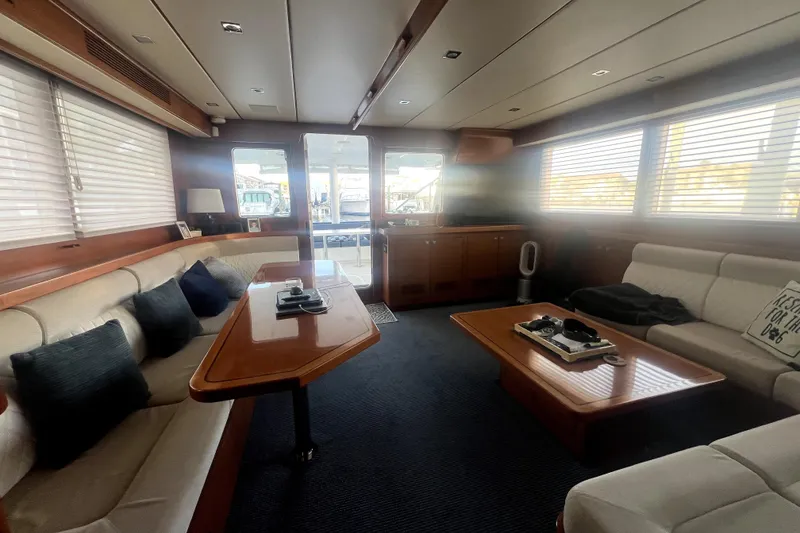 Slide: The Image of Luxurious interior of a 2016 Nordhavn 60 yacht with elegant seating and wooden accents. - 9
