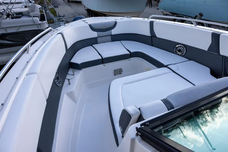 Slide: The Image of 2021 Chaparral 280 OSX boat interior with spacious seating and modern design. - 13