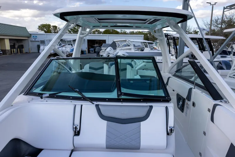 Slide: The Image of 2021 Chaparral 280 OSX boat interior with sleek design and modern features. - 15