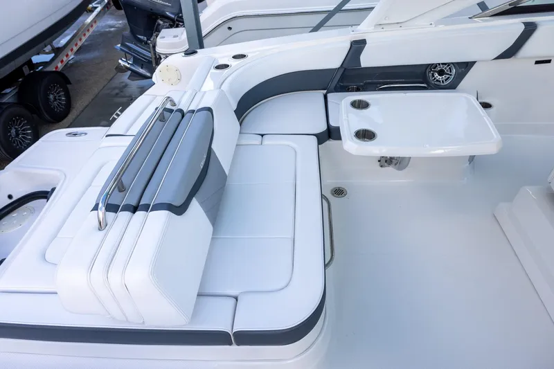 Slide: The Image of 2021 Chaparral 280 OSX boat interior with white seating and table. - 6