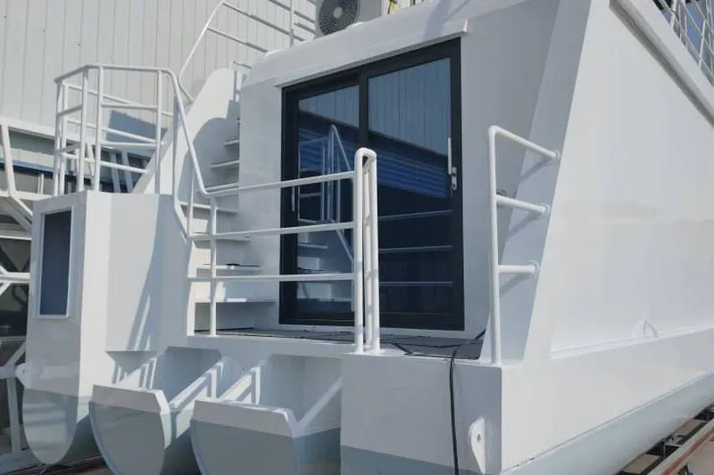 Slide: The Image of Modern 2025 Houseboat ALLHOUSE HB-1250 with sleek design and exterior staircase. - 19