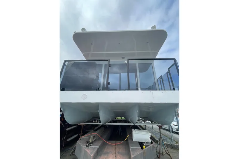 Slide: The Image of Modern 2025 Houseboat ALLHOUSE HB-1250 with sleek design and glass railings. - 2