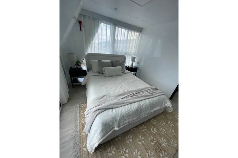 Slide: The Image of Cozy bedroom in 2025 ALLHOUSE HB-1250 houseboat with elegant decor and natural light. - 5