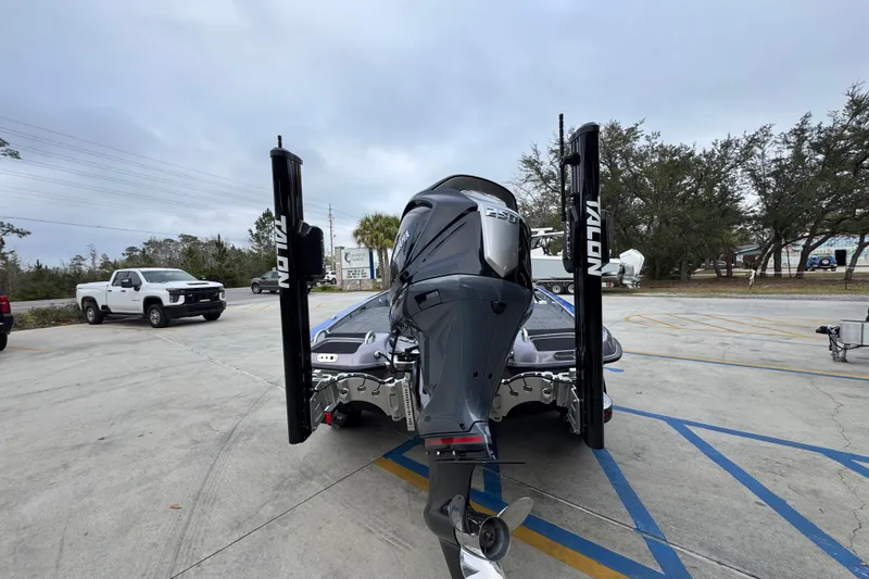 Slide: The Image of 2023 Phoenix 21 PHX boat with Talon anchors in a parking lot. - 13