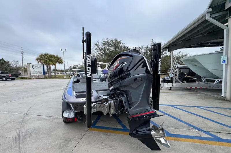 Slide: The Image of 2023 Phoenix 21 PHX boat with Yamaha engine in a marina parking lot. - 14