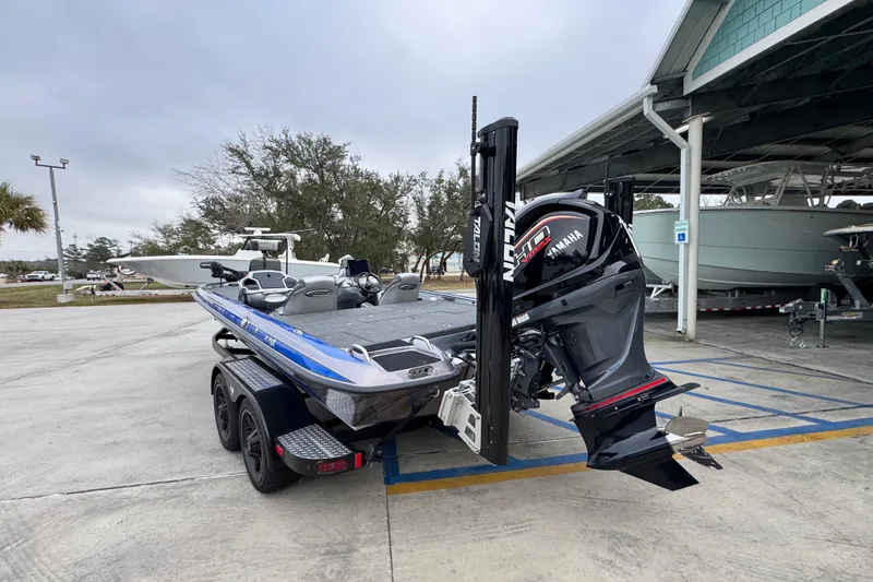 Slide: The Image of 2023 Phoenix 21 PHX boat with Yamaha engine in parking area. - 15