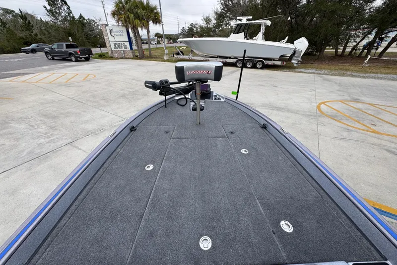 Slide: The Image of 2023 Phoenix 21 PHX boat deck with trolling motor in parking lot. - 17