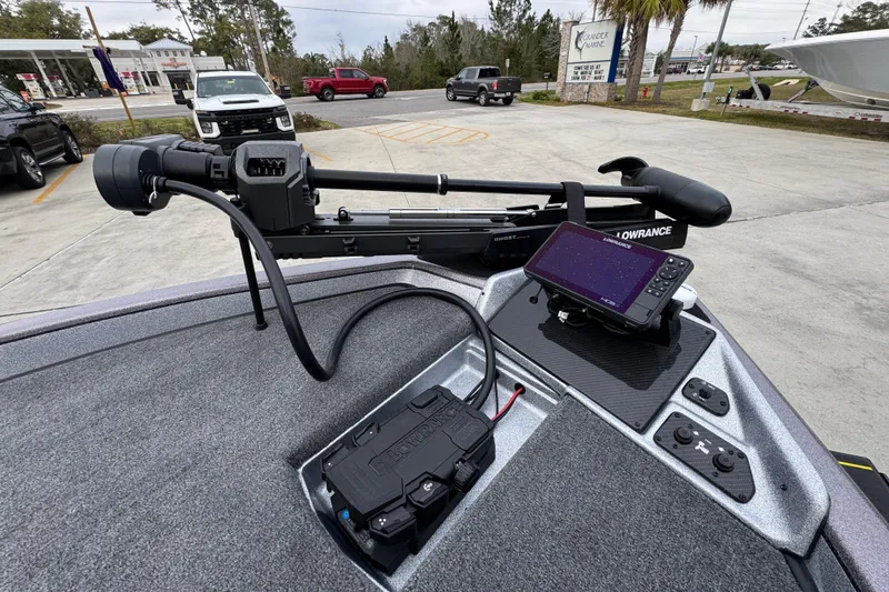 Slide: The Image of 2023 Phoenix 21 PHX boat with Lowrance electronics and trolling motor in parking lot. - 20