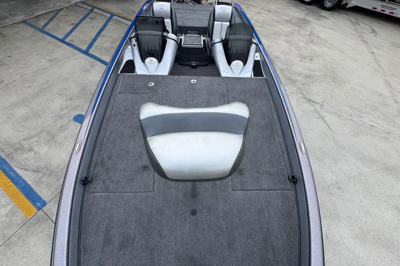 Slide: The Image of 2023 Phoenix 21 PHX boat interior with seating and carpeted deck. - 21