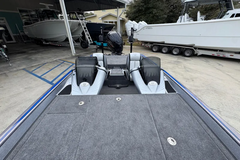 Slide: The Image of 2023 Phoenix 21 PHX boat interior with dual consoles and spacious deck. - 23