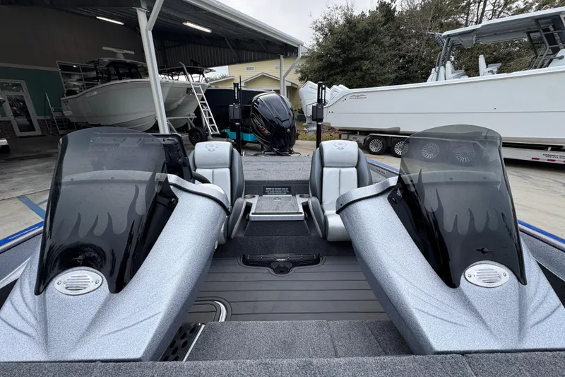 Slide: The Image of 2023 Phoenix 21 PHX boat interior with dual consoles and sleek design. - 24