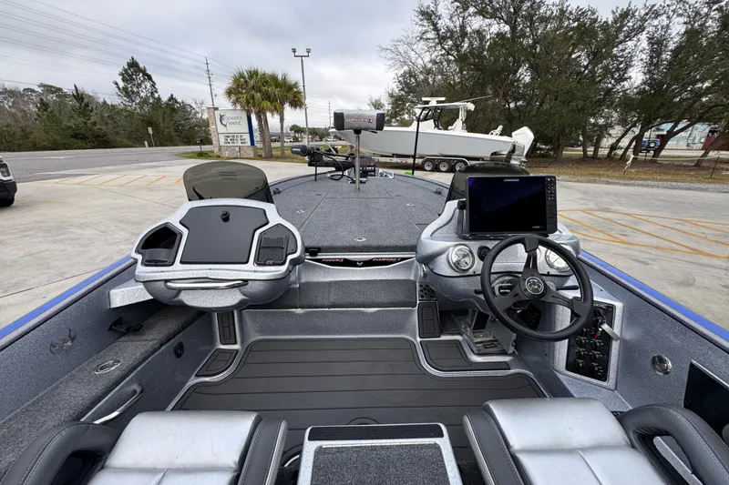 Slide: The Image of 2023 Phoenix 21 PHX boat interior with advanced navigation and control systems. - 26