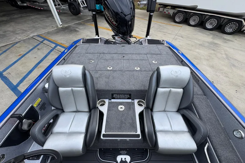 Slide: The Image of 2023 Phoenix 21 PHX boat interior with dual seats and storage compartments. - 31