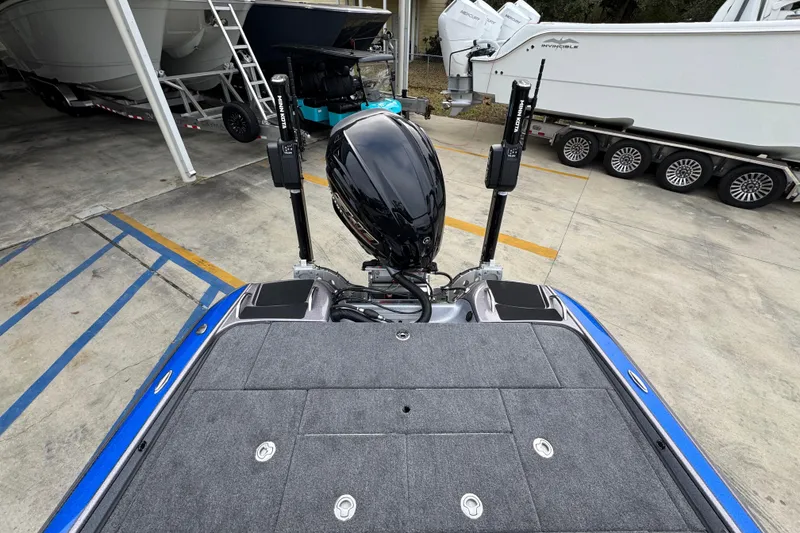 Slide: The Image of 2023 Phoenix 21 PHX boat with motor, parked in a marina. - 33