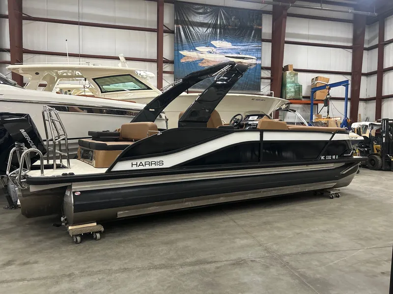 Slide: The Image of 2025 Harris Grand Mariner 250 pontoon boat in warehouse. - 23