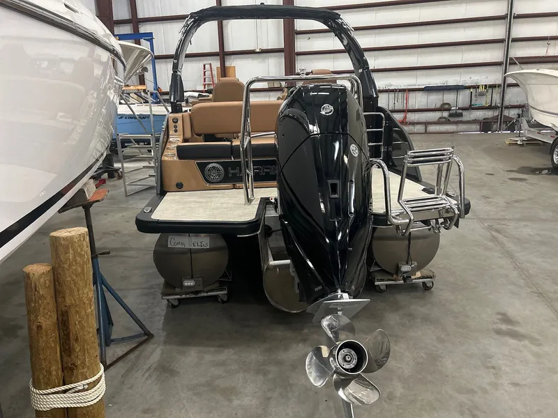 Slide: The Image of 2025 Harris Grand Mariner 250 pontoon boat in warehouse. - 24