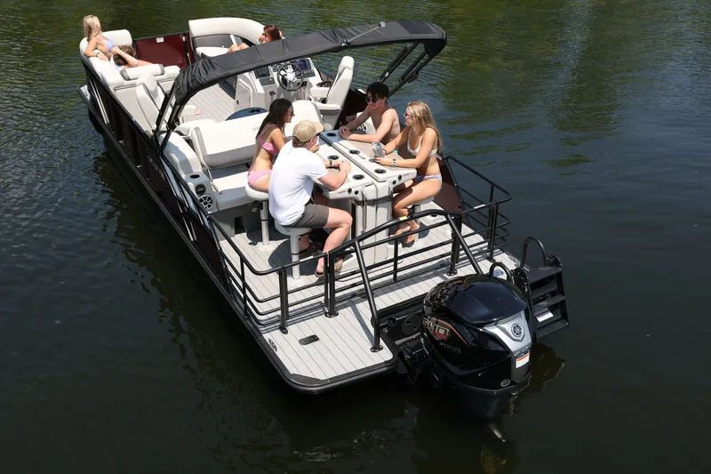 Slide: The Image of 2026 Sylvan Mirage X3 DLZ DH Bar pontoon boat on the water. - 3