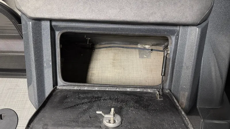 Slide: The Image of Open storage compartment in a 2018 Crest Caribbean boat. - 19