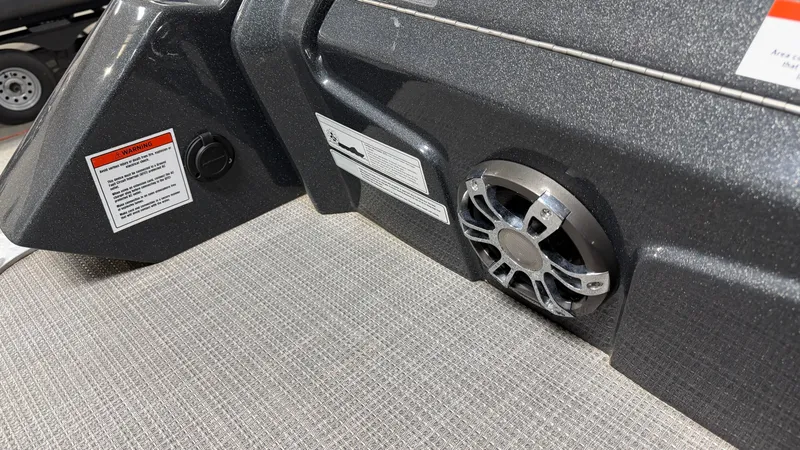 Slide: The Image of Speaker and warning labels on a 2018 Crest Caribbean boat. - 21