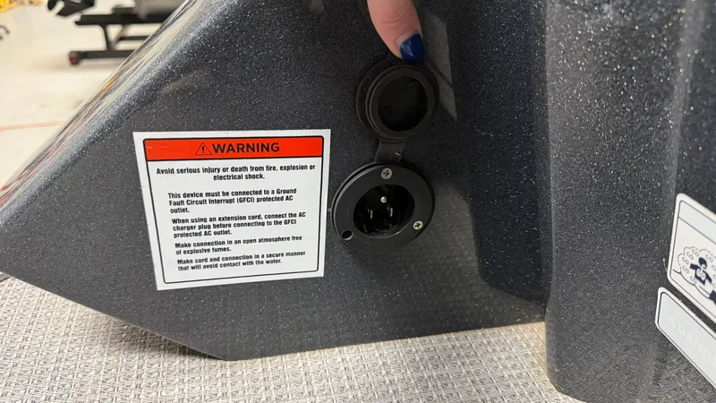 Slide: The Image of Warning label and socket on a 2018 Crest Caribbean. - 22