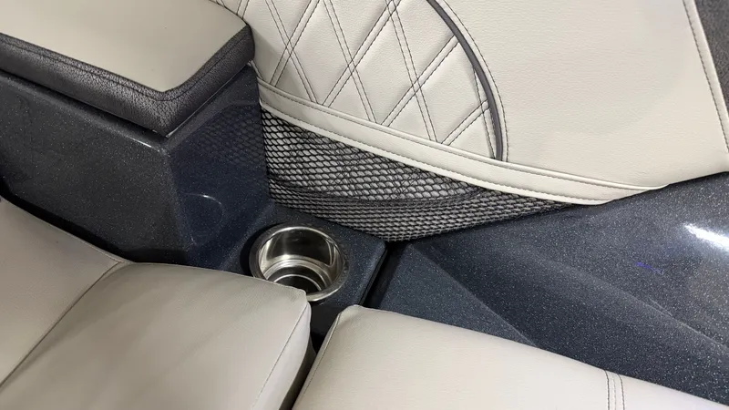Slide: The Image of Interior of a 2018 Crest Caribbean with cup holder and netting. - 37