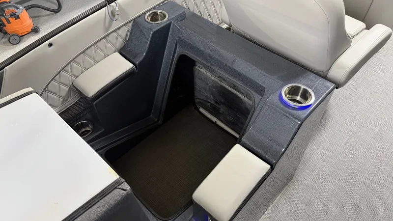 Slide: The Image of Interior of a 2018 Crest Caribbean boat with seating and cup holders. - 45