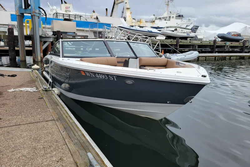 The Image of 2019 Cobalt CS22 boat docked at marina, featuring sleek design and comfortable seating. - 0