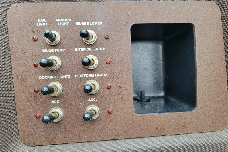 Slide: The Image of Control panel of a 2019 Cobalt CS22 boat with various switches and indicators. - 11