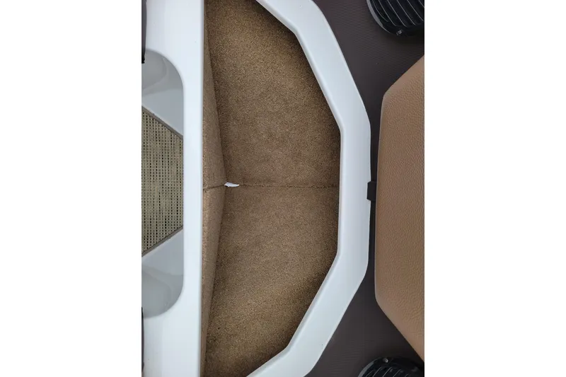 Slide: The Image of 2019 Cobalt CS22 boat interior with beige carpet and white trim. - 17