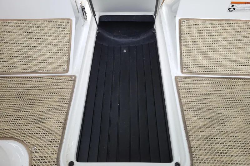 Slide: The Image of 2019 Cobalt CS22 boat interior with textured flooring and black non-slip surface. - 20
