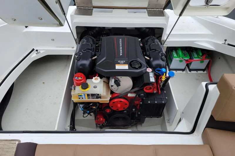 Slide: The Image of 2019 Cobalt CS22 boat engine compartment with Volvo Penta 240 V6 engine and batteries. - 23