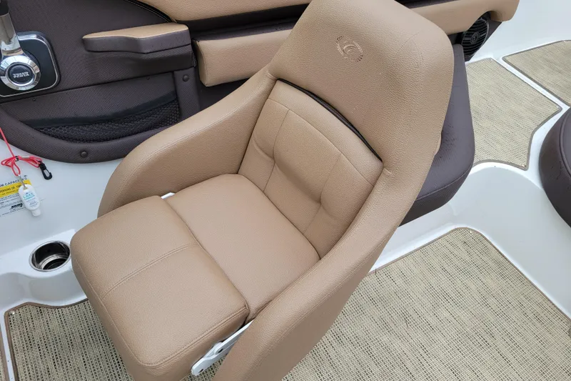 Slide: The Image of 2019 Cobalt CS22 boat interior with tan leather seat and beige flooring. - 7
