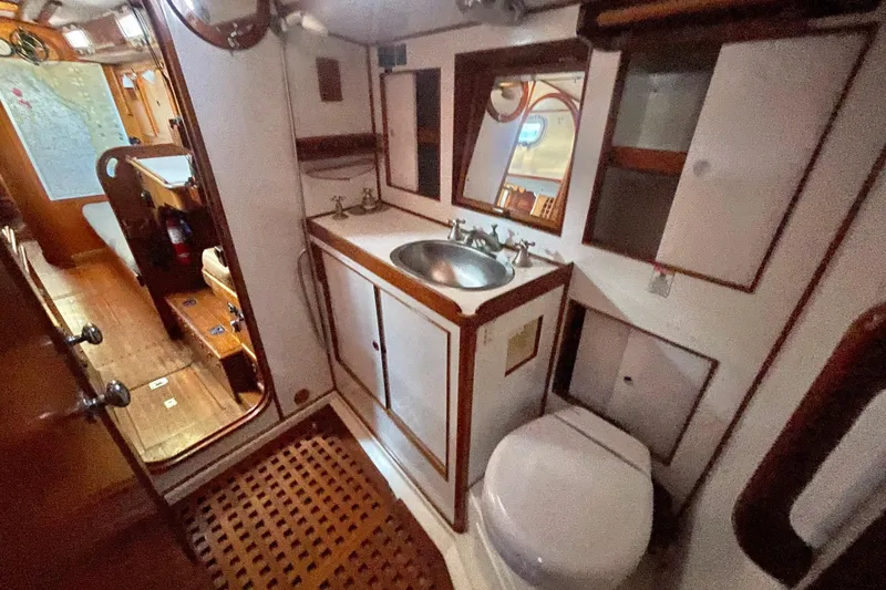 Slide: The Image of 1982 Stevens cutter yacht bathroom with wooden accents and nautical decor. - 22