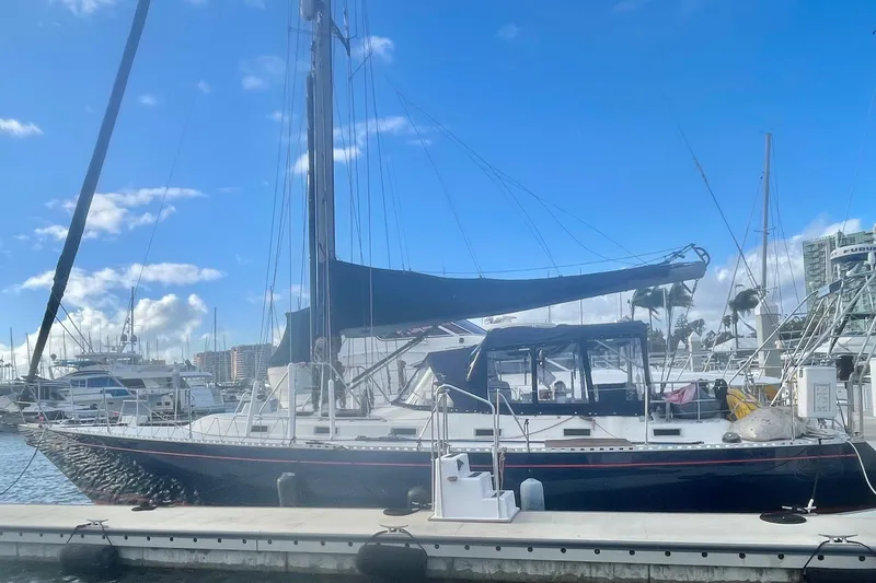 Slide: The Image of 1982 Stevens cutter sailboat docked at marina under clear blue sky. - 5