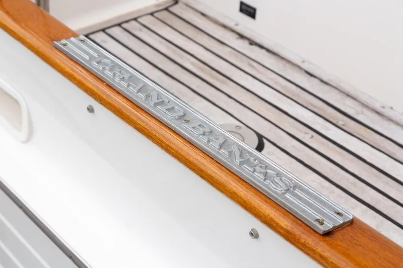 Slide: The Image of Close-up of wooden railing on 1993 Grand Banks 46 Motoryacht, showcasing craftsmanship and design. - 10
