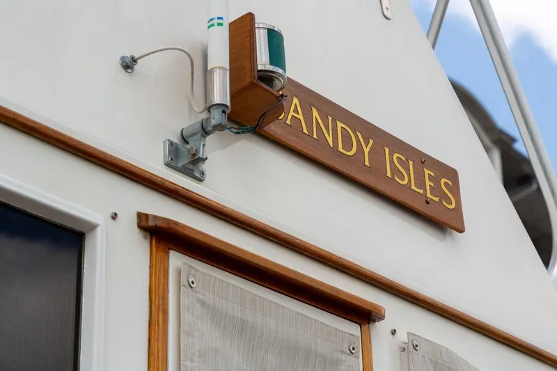 Slide: The Image of 1993 Grand Banks 46 Motoryacht docked at marina under cloudy sky. - 12
