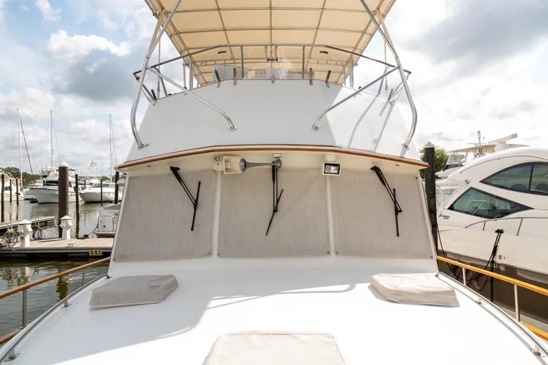 Slide: The Image of Bow view of 1993 Grand Banks 46 Motoryacht with teak deck and marine equipment. - 13
