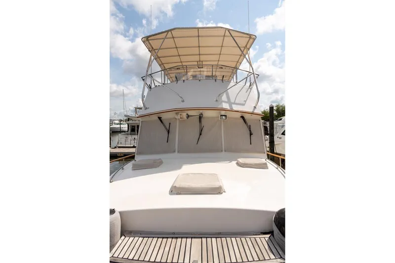 Slide: The Image of Deck detail of 1993 Grand Banks 46 Motoryacht with polished wood and coiled rope. - 19