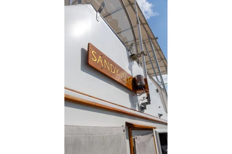 Slide: The Image of 1993 Grand Banks 46 Motoryacht helm with wooden steering wheel and navigation equipment. - 21