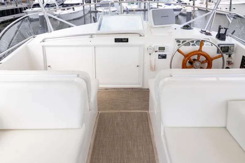 Slide: The Image of 1993 Grand Banks 46 Motoryacht helm with wooden wheel and navigation equipment. - 22