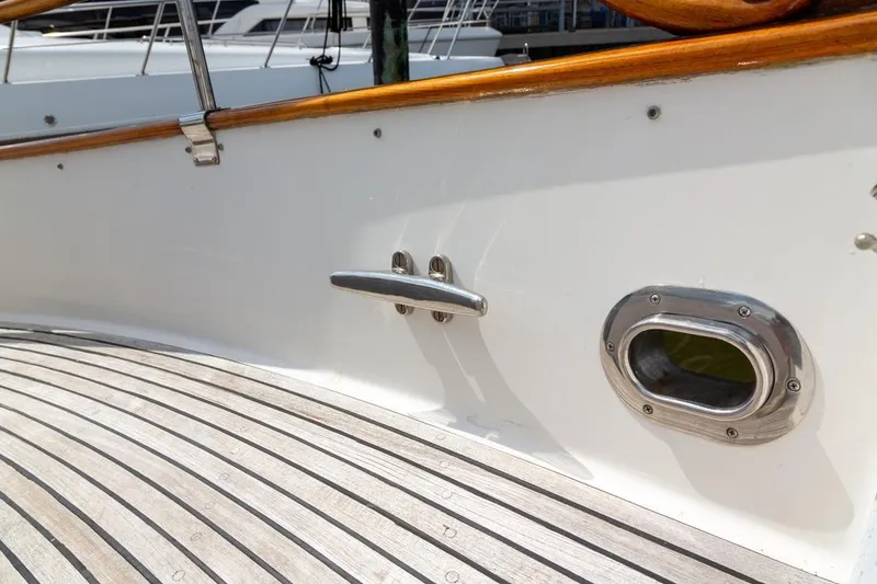 Slide: The Image of Deck view of 1993 Grand Banks 46 Motoryacht with wooden rail and cleats. - 25