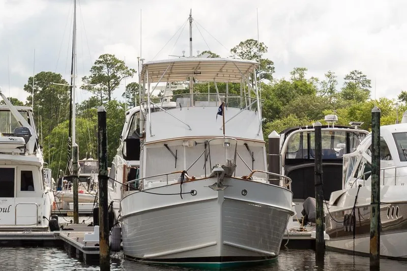 Slide: The Image of Grand Banks 46 Motoryacht 1993 docked at marina, surrounded by other boats. - 3