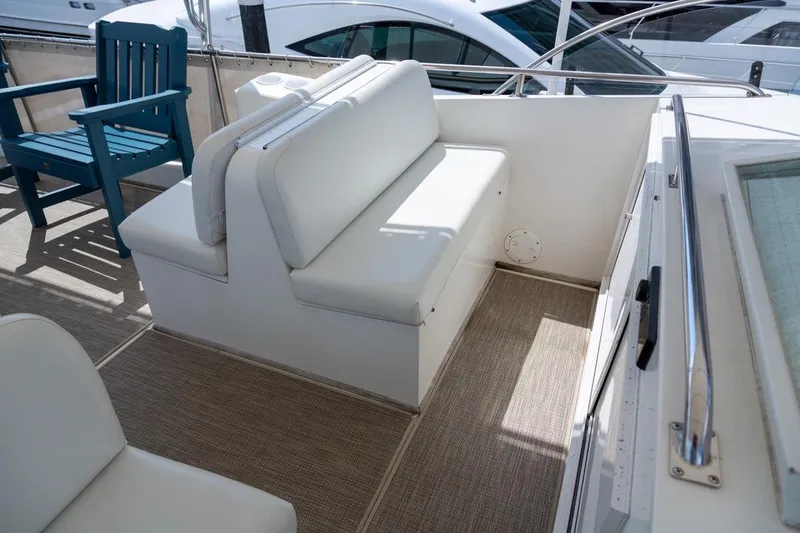 Slide: The Image of Spacious deck of 1993 Grand Banks 46 Motoryacht with seating and table, docked at marina. - 30