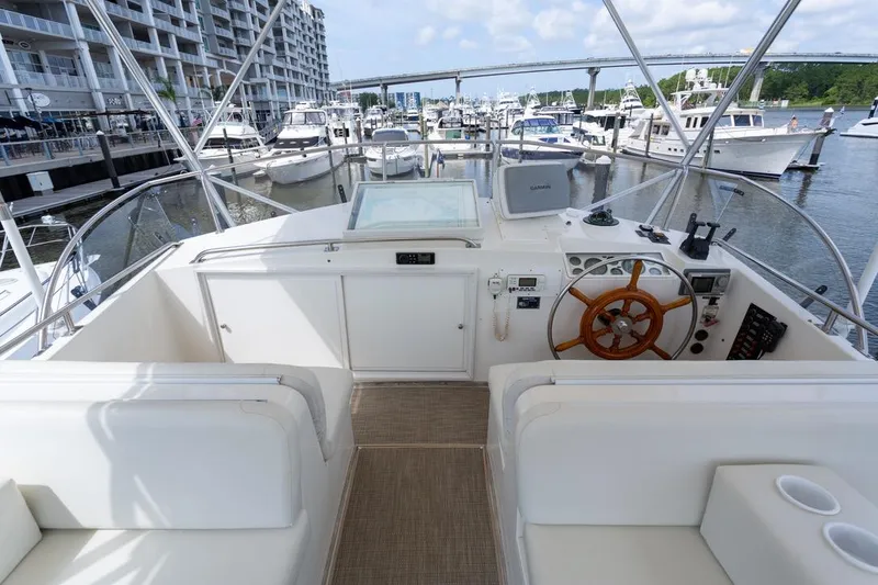 Slide: The Image of 1993 Grand Banks 46 Motoryacht deck with seating, docked at marina. - 33