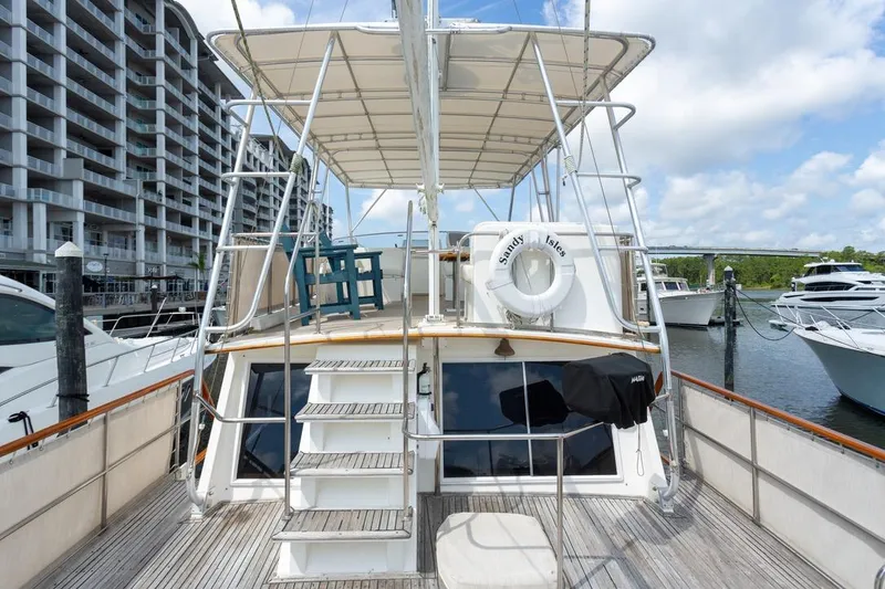 Slide: The Image of Side view of 1993 Grand Banks 46 Motoryacht docked at marina. - 41