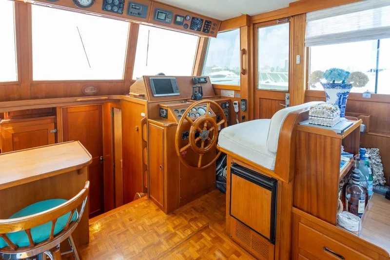 Slide: The Image of Interior of 1993 Grand Banks 46 Motoryacht with wooden cabinetry and bar seating. - 57